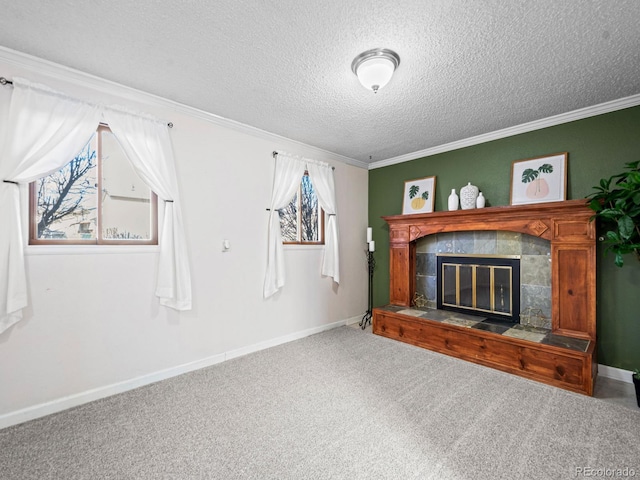 unfurnished living room with crown molding, a fireplace, a textured ceiling, and carpet