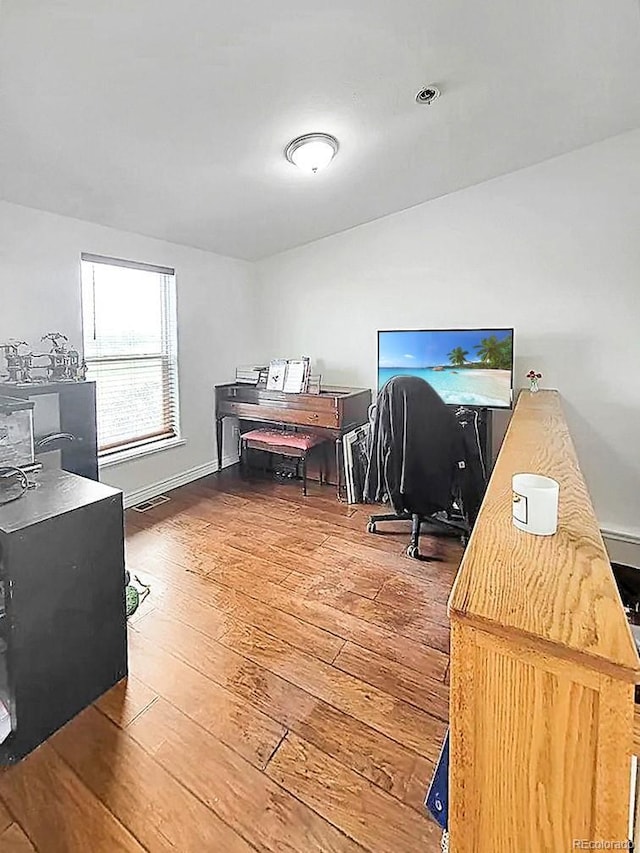 58117 E 42nd Dr, Strasburg, CO 80136 - home office with hardwood / wood-style floors and baseboards