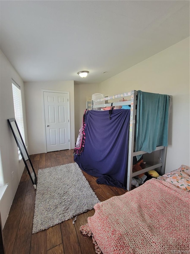 58117 E 42nd Dr, Strasburg, CO 80136 - bedroom featuring hardwood / wood-style floors