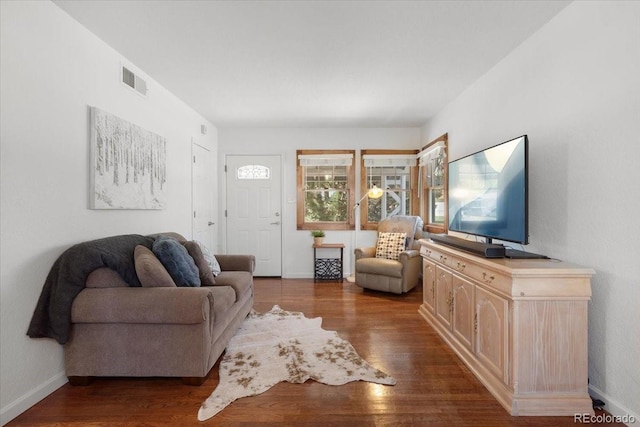 1568 S Osceola Way, Denver, CO 80219 - living area with dark wood-style flooring and baseboards