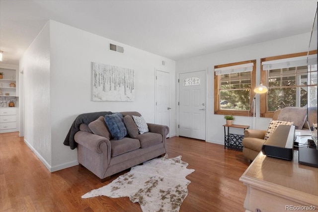 1568 S Osceola Way, Denver, CO 80219 - living area with wood finished floors and baseboards