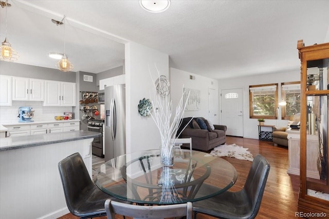 1568 S Osceola Way, Denver, CO 80219 - dining space featuring wood finished floors and baseboards