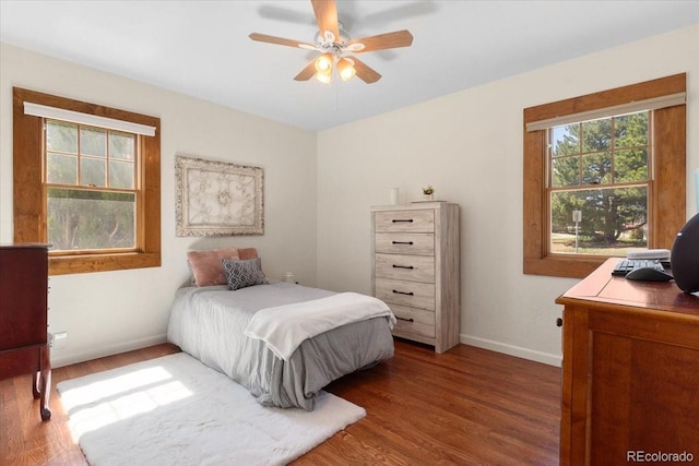 1568 S Osceola Way, Denver, CO 80219 - bedroom featuring wood finished floors, baseboards, a desk, and a ceiling fan