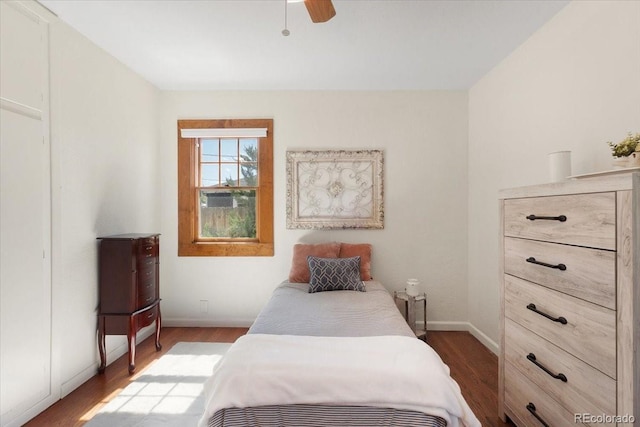 1568 S Osceola Way, Denver, CO 80219 - bedroom featuring wood finished floors, baseboards, and ceiling fan