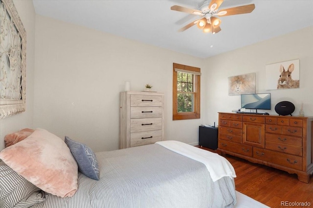 1568 S Osceola Way, Denver, CO 80219 - bedroom featuring wood finished floors and a ceiling fan