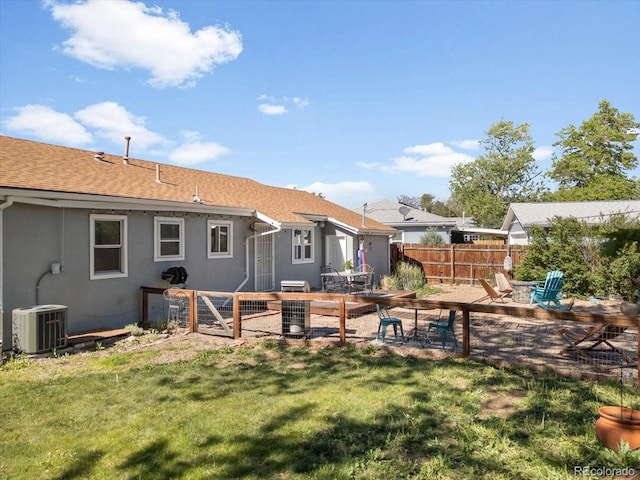 1568 S Osceola Way, Denver, CO 80219 - rear view of property featuring stucco siding, central air condition unit, and a patio