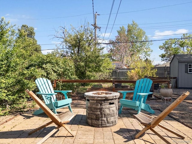 1568 S Osceola Way, Denver, CO 80219 - view of patio with an outdoor fire pit and a shed