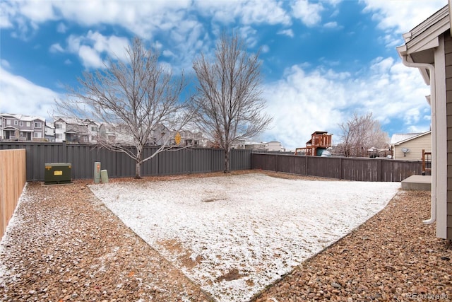 view of yard featuring a playground, fence private yard, and a residential view