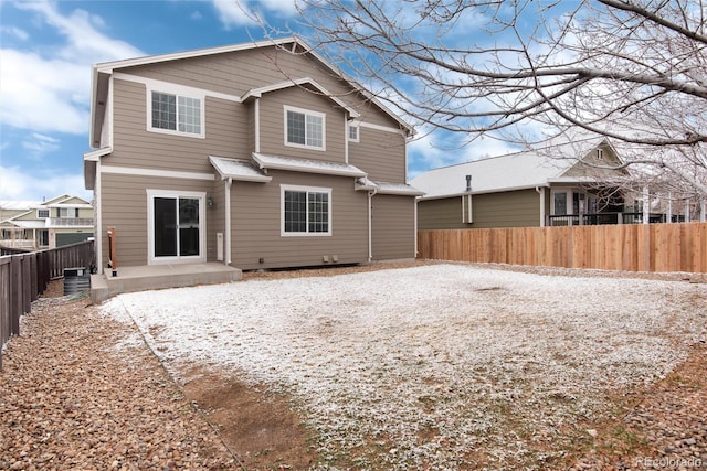 back of property featuring a patio area and a fenced backyard