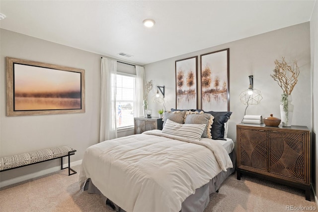 bedroom with light colored carpet