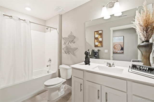 full bathroom featuring vanity, toilet, tile patterned floors, and shower / tub combo