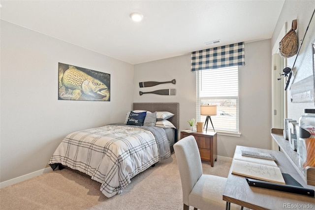 bedroom featuring light carpet