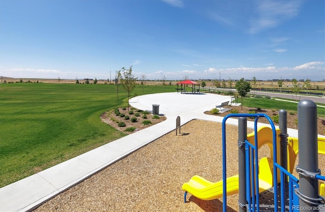 view of play area featuring a lawn