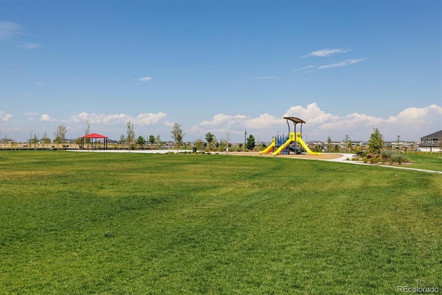 view of community featuring a yard, a gazebo, and a playground