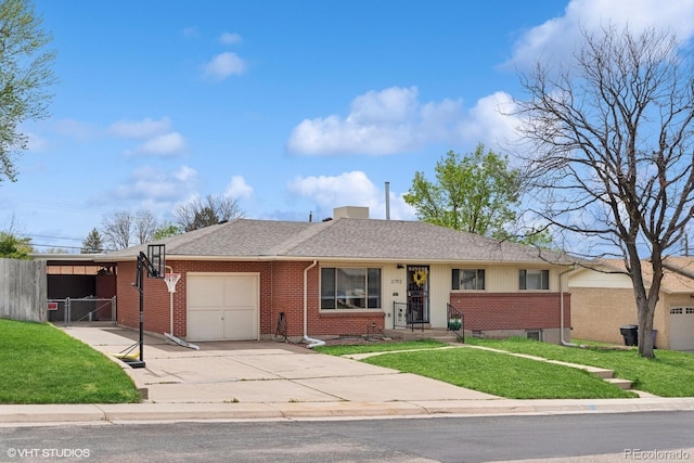 2792 S Stuart St, Denver, CO 80236 - ranch-style home with brick siding, a garage, driveway, and a shingled roof