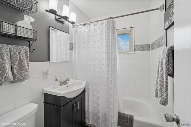 2792 S Stuart St, Denver, CO 80236 - bathroom featuring toilet, vanity, shower / bath combo, and tile walls