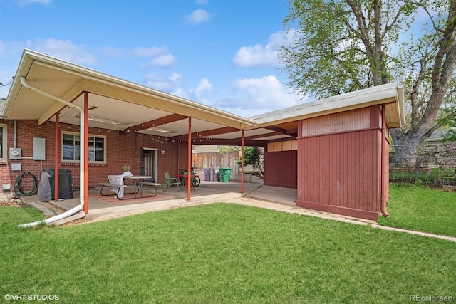 2792 S Stuart St, Denver, CO 80236 - back of property with a patio area and brick siding