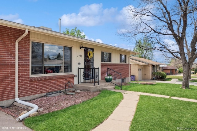 2792 S Stuart St, Denver, CO 80236 - single story home with brick siding and a front yard