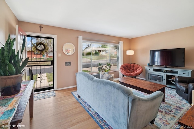 2792 S Stuart St, Denver, CO 80236 - living area with light wood-style flooring and baseboards
