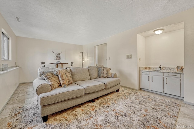 living room featuring a textured ceiling