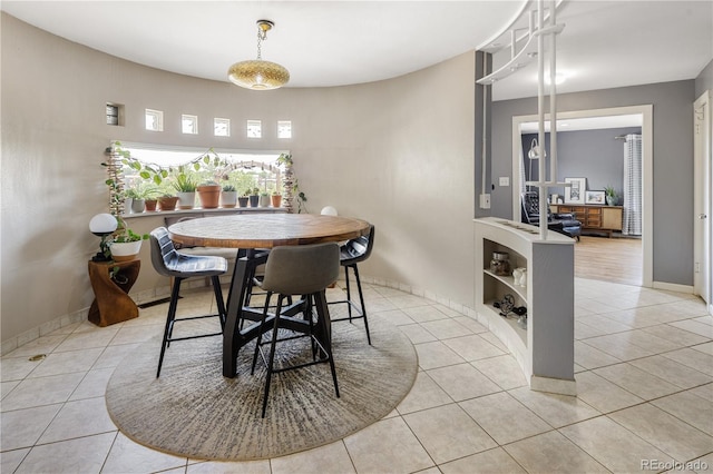 4647 W Dakota Ave, Denver, CO 80219 - dining area with light tile patterned flooring and baseboards