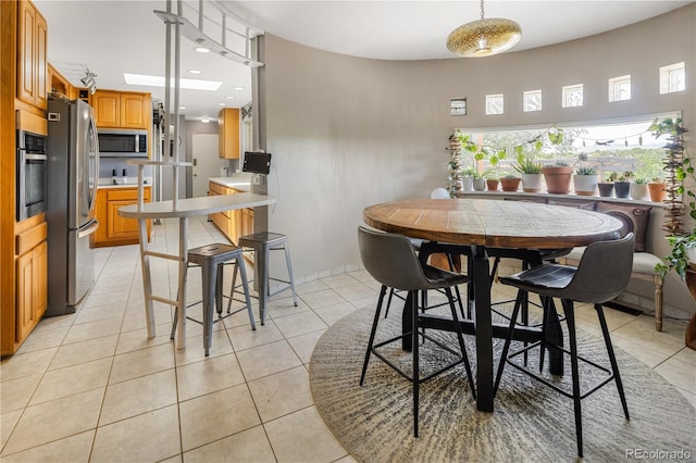 4647 W Dakota Ave, Denver, CO 80219 - dining area featuring light tile patterned flooring and recessed lighting