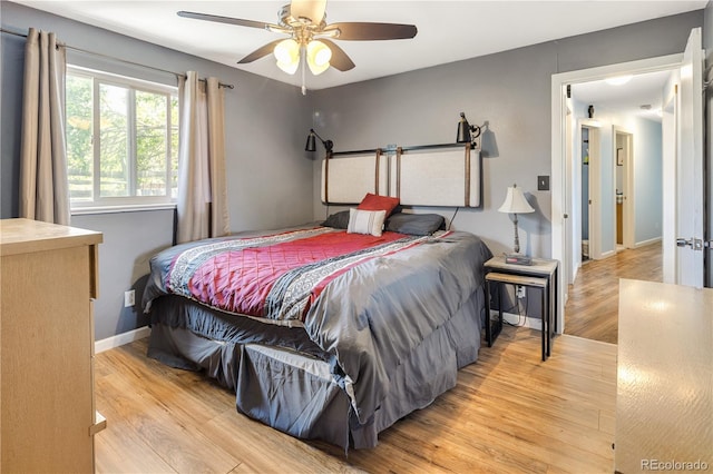 4647 W Dakota Ave, Denver, CO 80219 - bedroom with light wood-type flooring and a ceiling fan