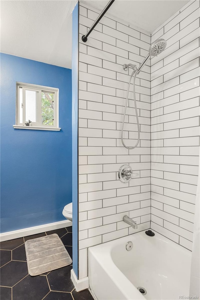 4647 W Dakota Ave, Denver, CO 80219 - full bath with tile patterned floors and shower / bath combination