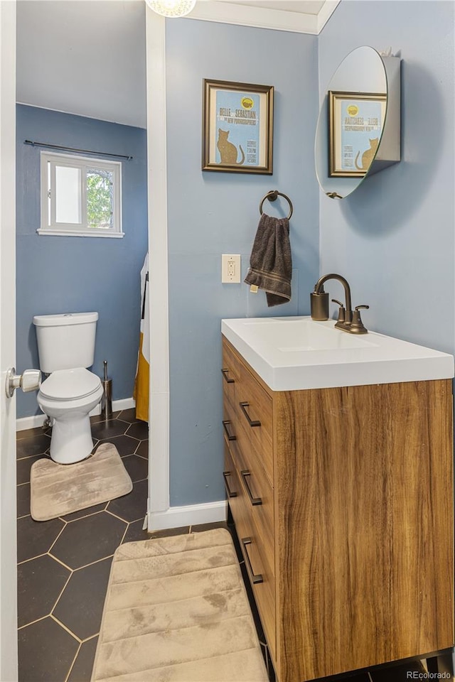 4647 W Dakota Ave, Denver, CO 80219 - bathroom with vanity and toilet