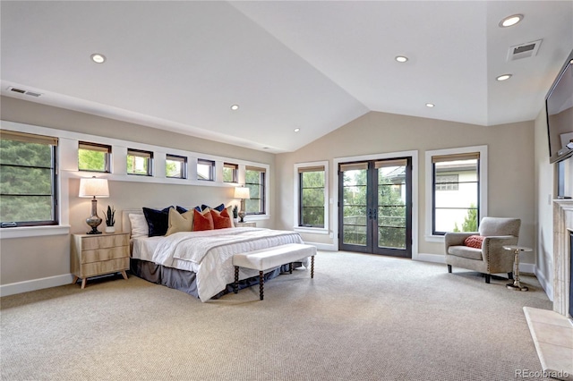 bedroom featuring lofted ceiling, french doors, visible vents, and carpet