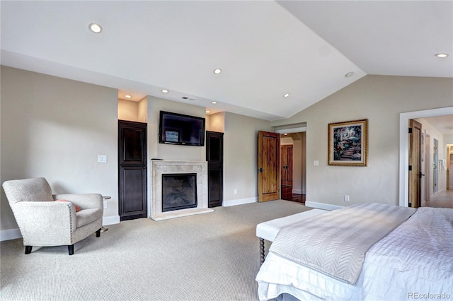carpeted bedroom with a tiled fireplace, baseboards, lofted ceiling, visible vents, and recessed lighting