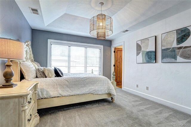 bedroom featuring baseboards, light carpet, visible vents, and an inviting chandelier