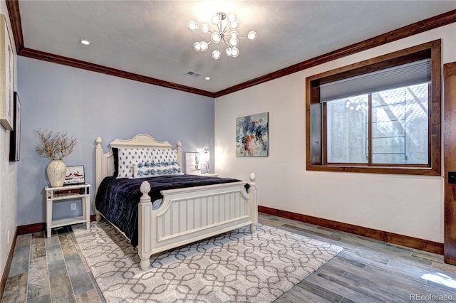 bedroom with visible vents, wood finished floors, baseboards, and ornamental molding