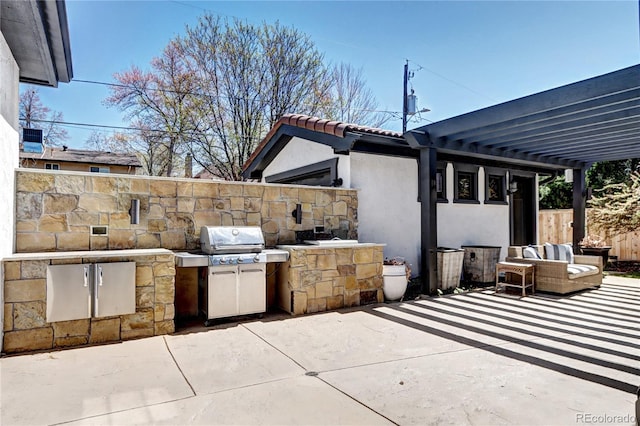 view of patio featuring a grill and exterior kitchen