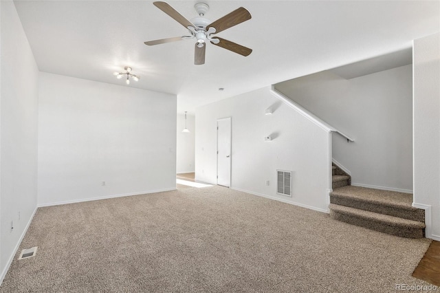 10578 Country Park Pt, Fountain, CO 80817 - unfurnished living room featuring stairs, a ceiling fan, carpet, and baseboards