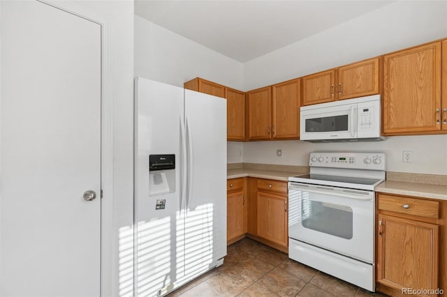 10578 Country Park Pt, Fountain, CO 80817 - kitchen featuring white appliances, light countertops, and brown cabinets