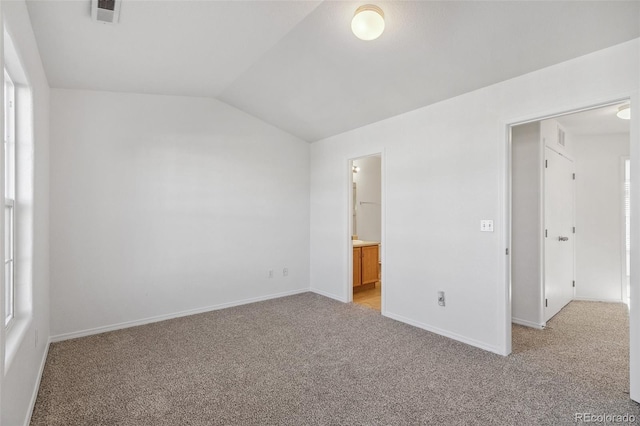 10578 Country Park Pt, Fountain, CO 80817 - unfurnished bedroom featuring lofted ceiling, light carpet, baseboards, and ensuite bathroom