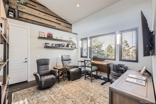 home office featuring light wood-type flooring and lofted ceiling