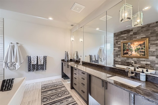 bathroom featuring vanity and a bathing tub