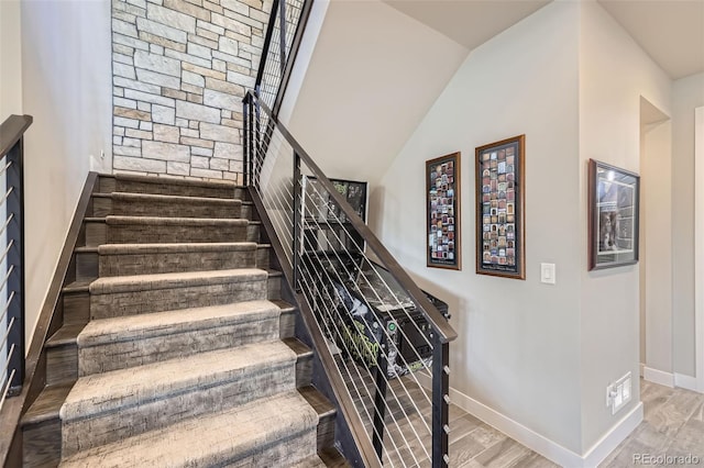 staircase with wood-type flooring