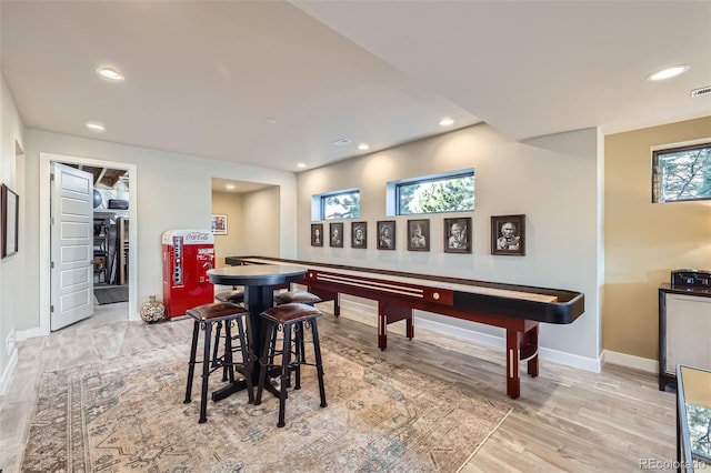 recreation room featuring light hardwood / wood-style flooring