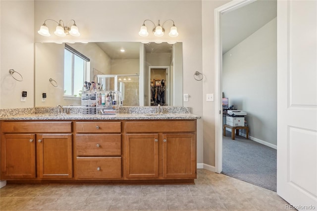 bathroom featuring vanity, tile patterned flooring, and an enclosed shower