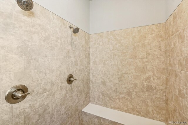 bathroom featuring tiled shower