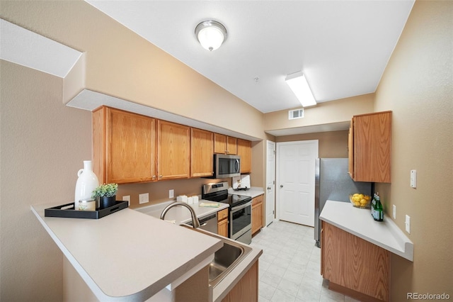 kitchen featuring kitchen peninsula and appliances with stainless steel finishes