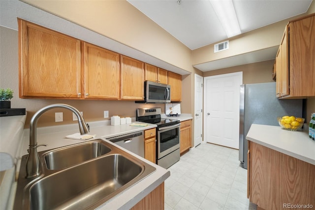 kitchen featuring appliances with stainless steel finishes and sink