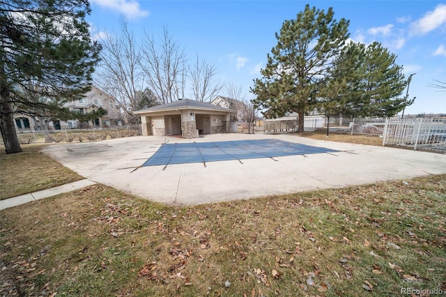 view of pool with a patio area and a lawn