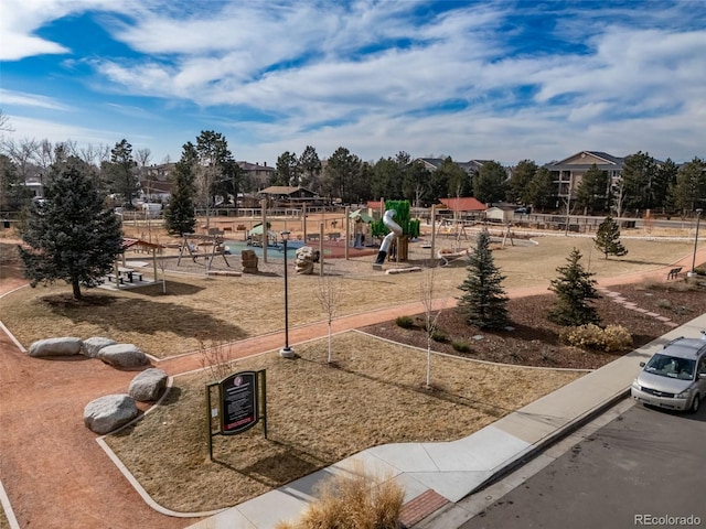 view of home's community featuring a playground