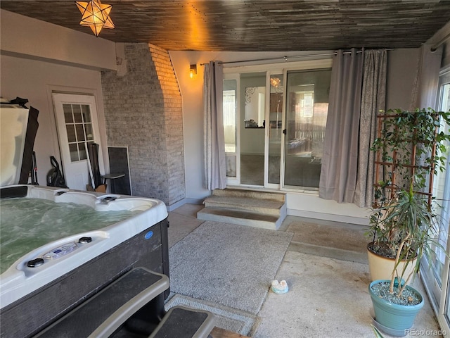 entrance to property featuring a hot tub