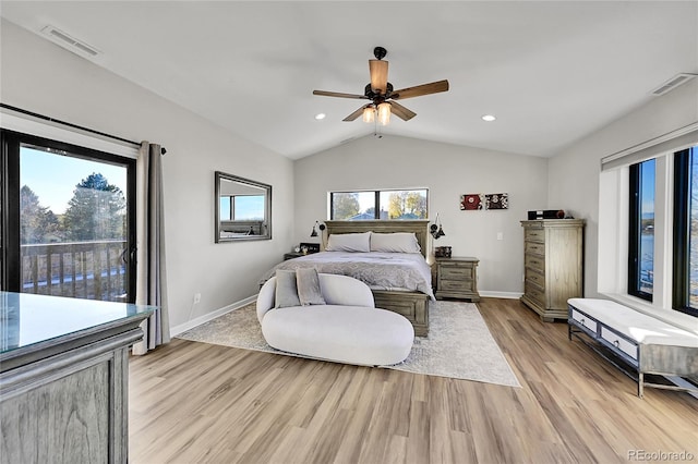 bedroom featuring ceiling fan, light wood-type flooring, and vaulted ceiling