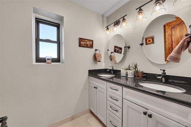 bathroom with tile patterned floors and vanity